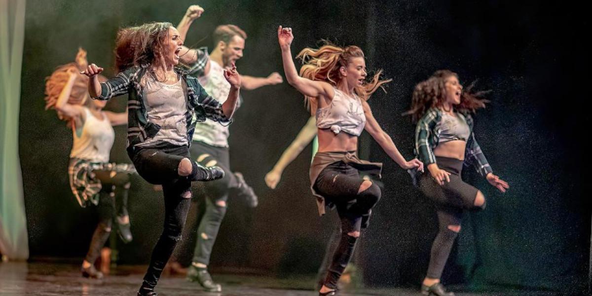 A group of dancers performing at the Guild Hall