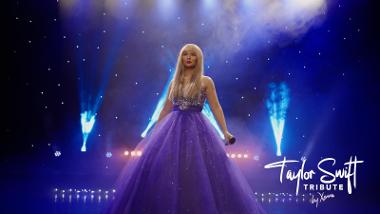 Xenna from the Taylor Swift Tribute on stage in a large purple dress